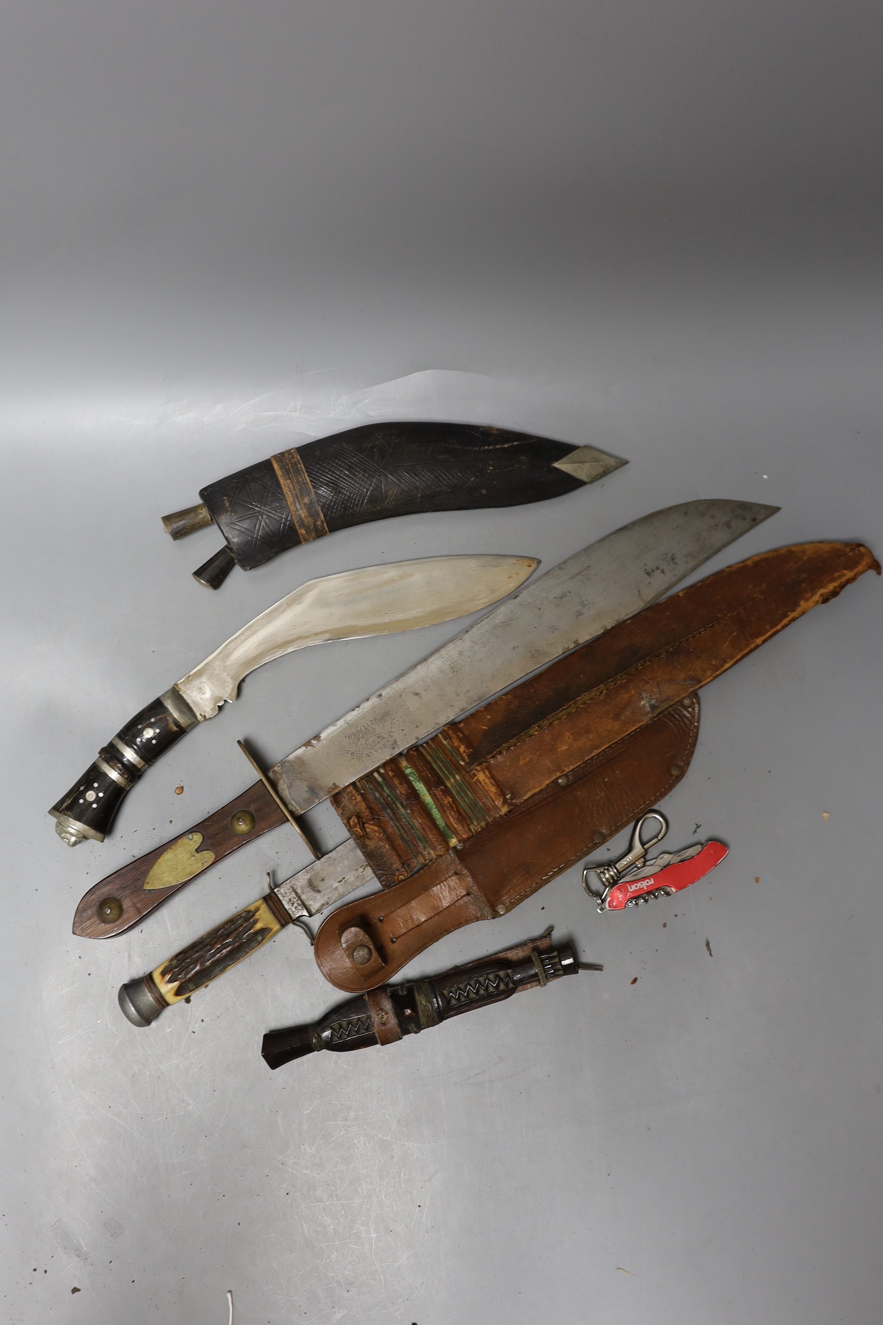 A group of knives and kukri and skean